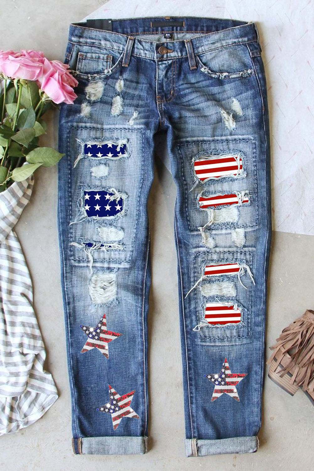 Distressed US flag mid-rise straight jeans with patches and star designs.