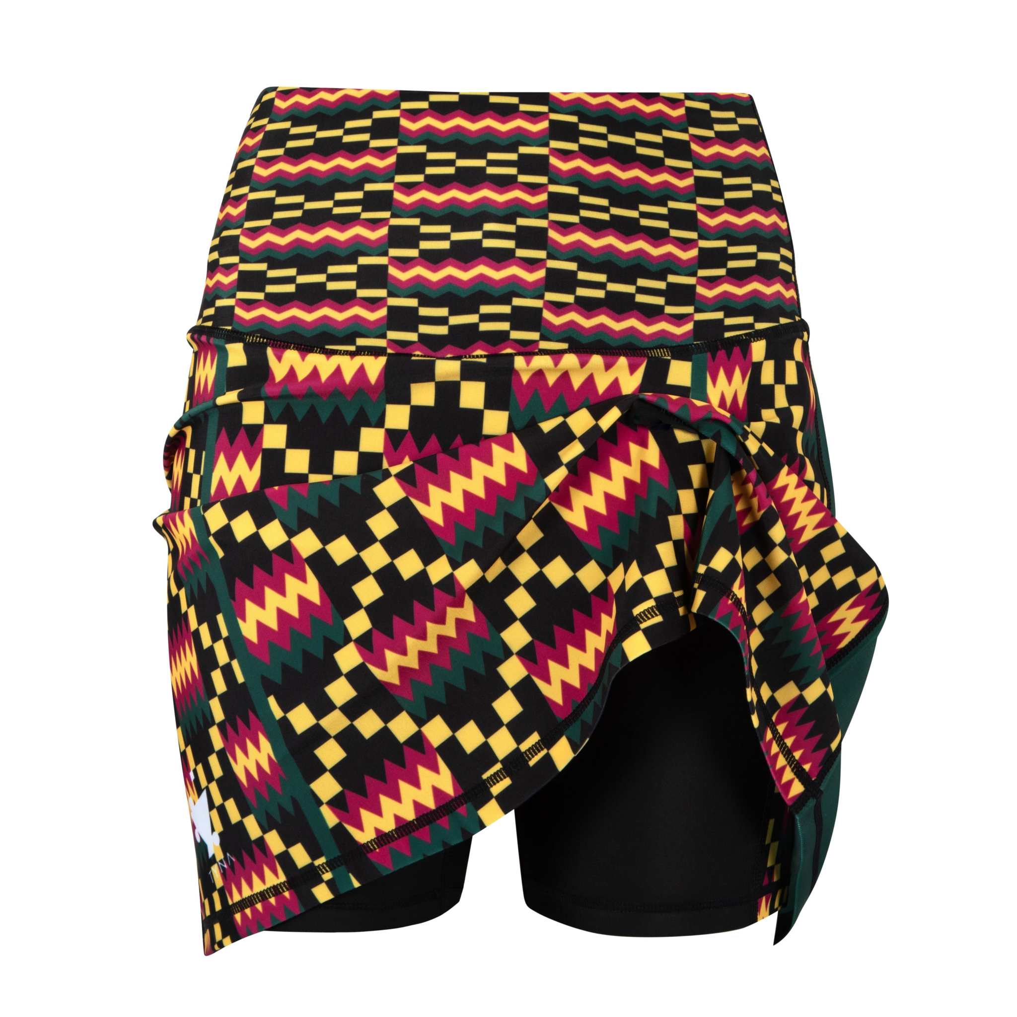 Kayentee High Rise Tennis Skort with vibrant geometric design and compressive biker shorts underneath.