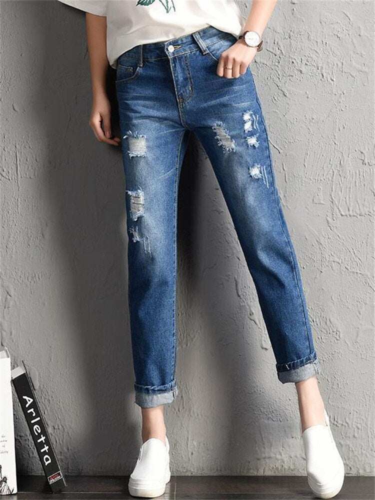 Women fashion mid waist ripped boyfriend jeans with pockets.