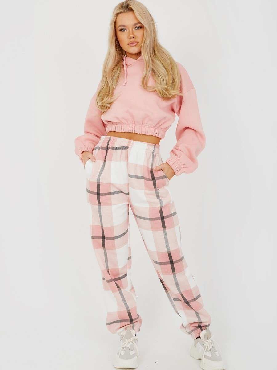 Light pink checked joggers for women with elasticated waist and side pockets.