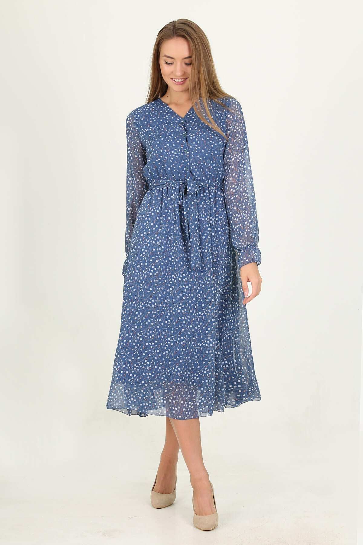 Blue dress with transparent long sleeves, v-neck, and belted waist.