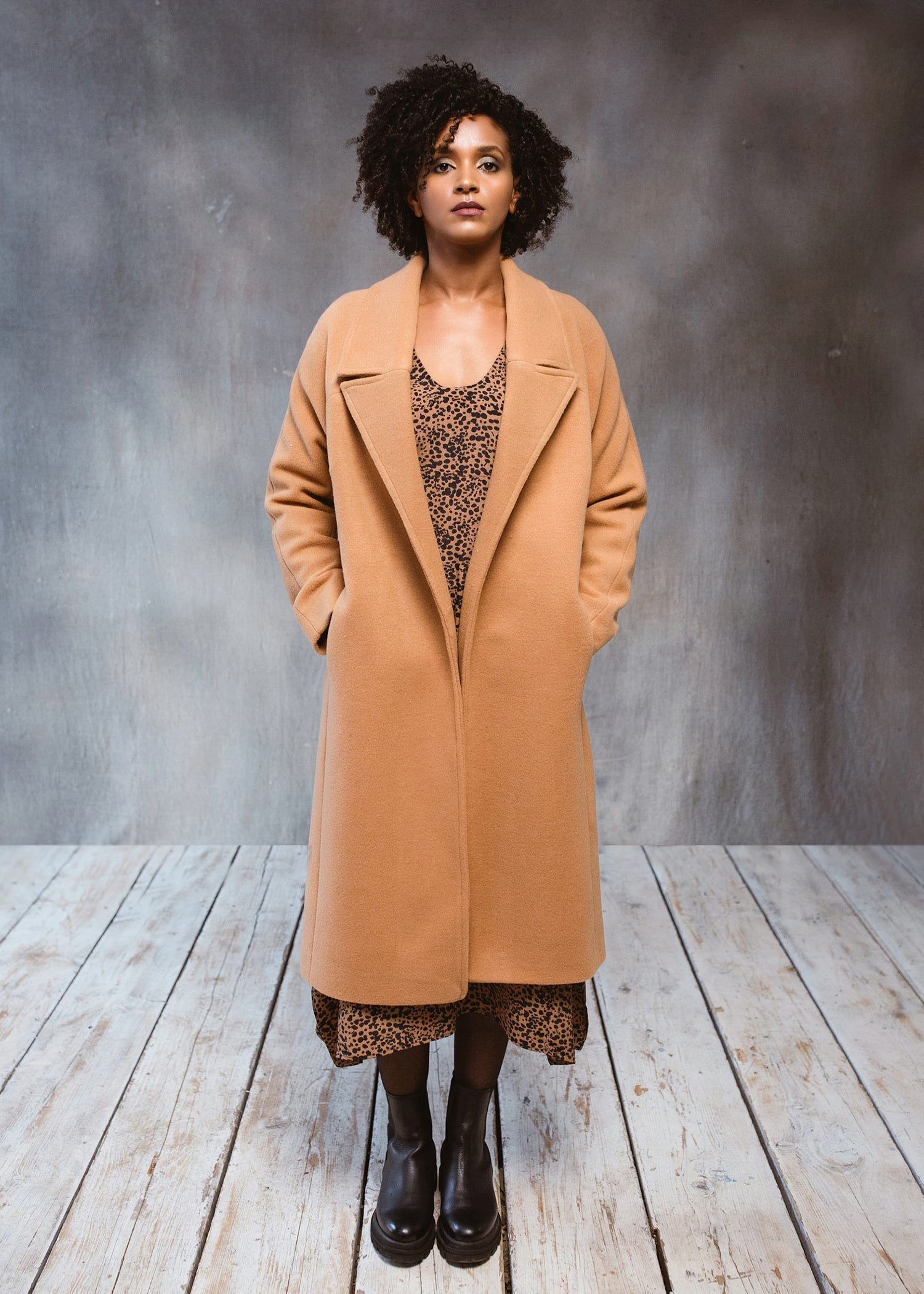 Warm woolen camel coat with raglan sleeves for layering.