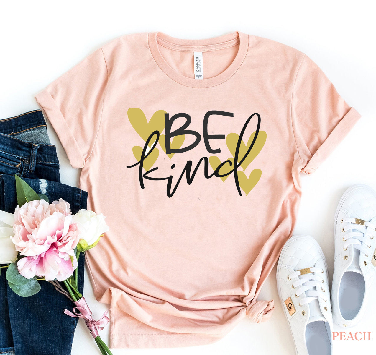 Be Kind t-shirt in peach color with heart design, premium cotton fabric, Bella Canvas brand.