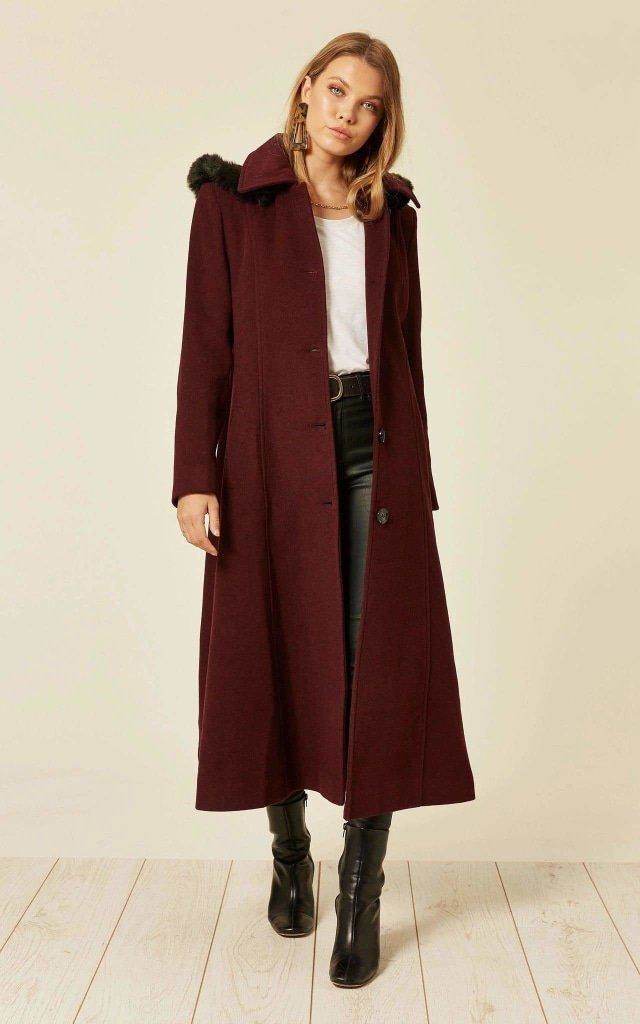 Wool blend long coat with faux fur trim hood, single breasted, side pockets, in a burgundy color.
