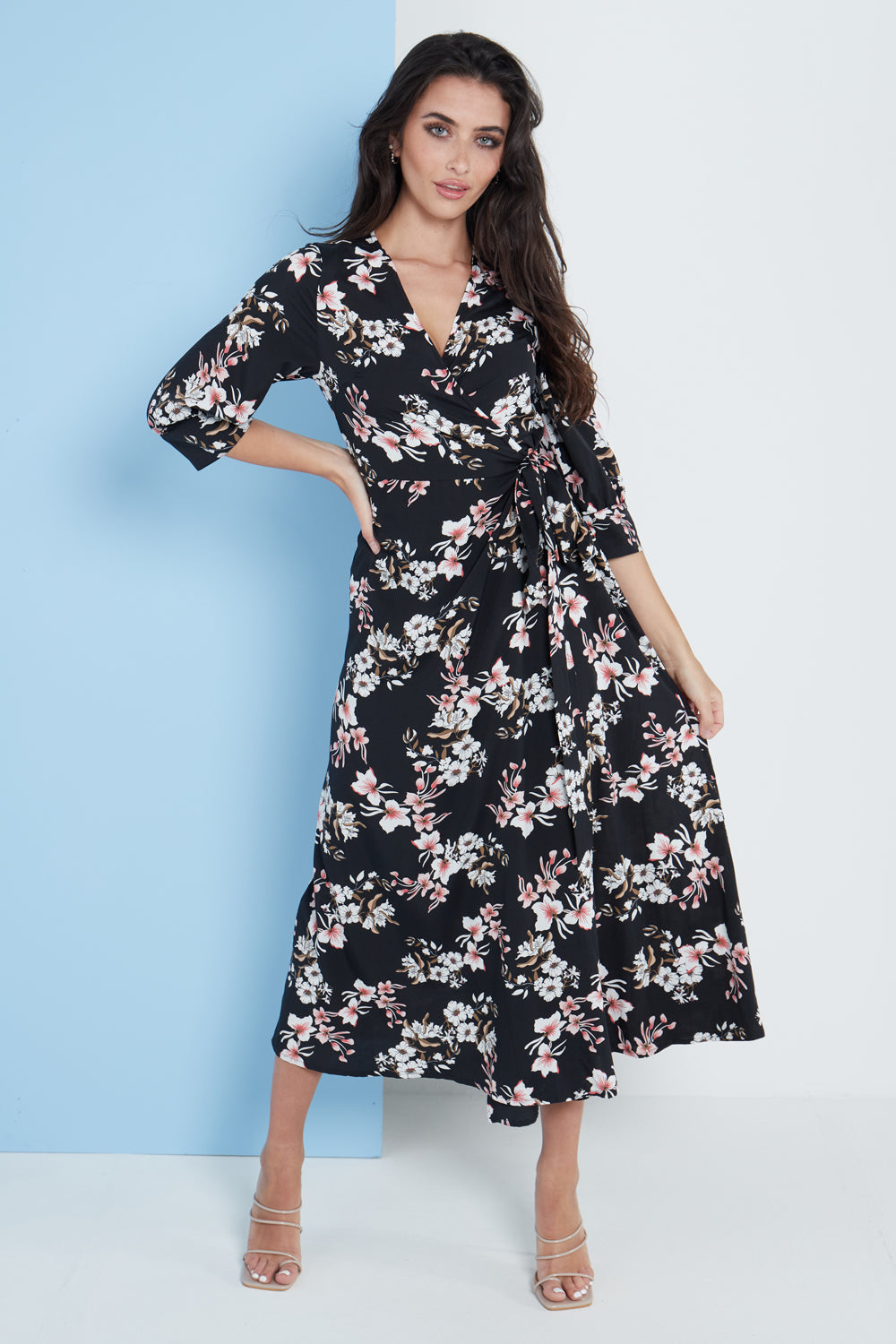 Black floral print midi wrap dress with half-length sleeves and belt.