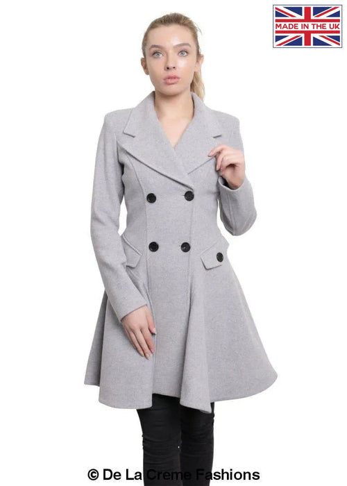 Wool Blend Double Breasted Skater Coat (1102) by De La Creme Fashions, featuring a slim A-line cut, double-breasted fastening, and side pockets. Made in England with Italian fabric.