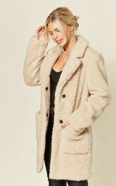 Oversized hip length coat with borg teddy finish and stud buttons.