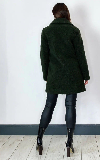 Oversized hip-length stud button borg teddy coat in dark green with popper button fastening.