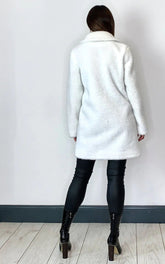 Oversized white stud button borg teddy coat with popper fastening and pockets.