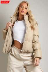 PU Boxy Puffer Jacket in beige with high neck and side pockets.