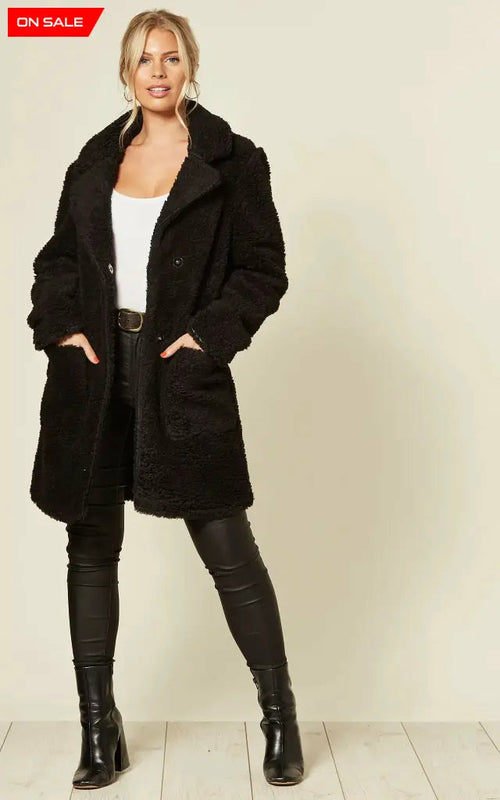 Oversized black borg teddy coat with stud button fastening and pockets.